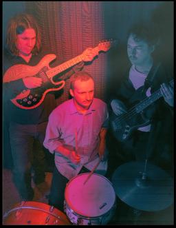blue and red photograph of the band